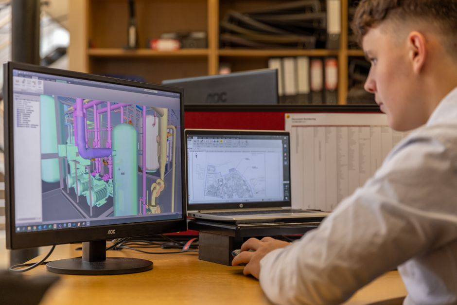 Nhat Nam engineering team collaborating on DFM to optimize sheet metal fabrication costs in Vietnam