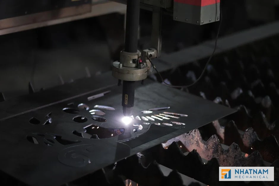 Advanced metal laser cutting machine in operation at Nhat Nam Sheet Metal, demonstrating precision fabrication capabilities.